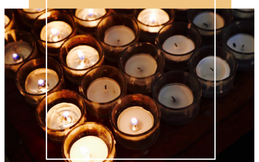 Congregation holding candles during acoustic worship service at Platt Park Church