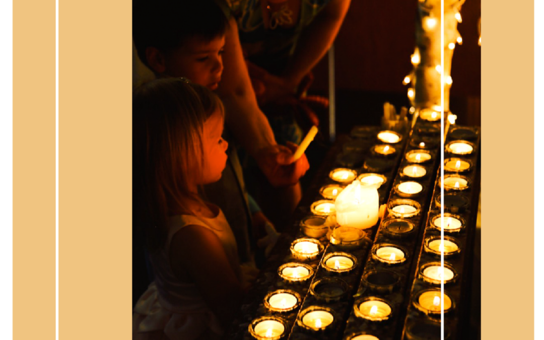 A family lighting candles at Platt Park Church during a serene moment of prayer and reflection.